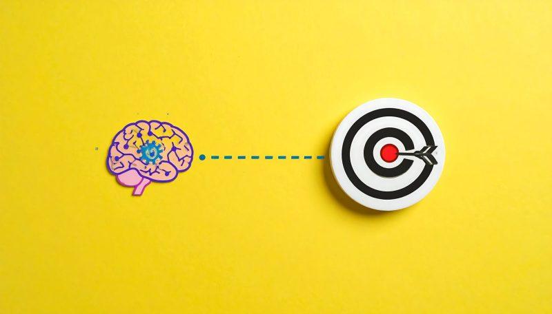 Illustration d’un cerveau connecté à une cible pour symboliser la clarté et la précision d’une Unique Selling Proposition